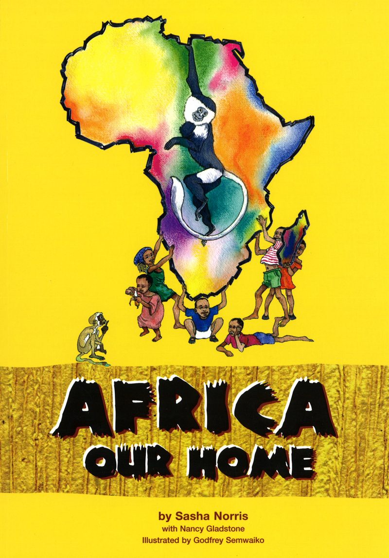 Cover of the Pan-African Conservation Education textbook. Features a rainbow-colored African continent on a yellow background with children dancing around the southern border.