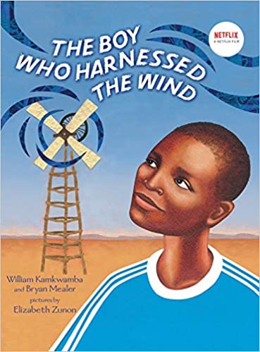 Cover of the book The Boy Who Harnessed the Wind. Features a young William Kamkwamba illustrated staring across a desert at a windmill.