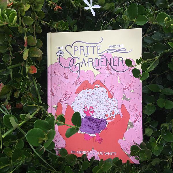 Cover of the book The Sprite and the Gardener. Features an illustration of the protagonist sprite being held in human hands with a garden backdrop.
