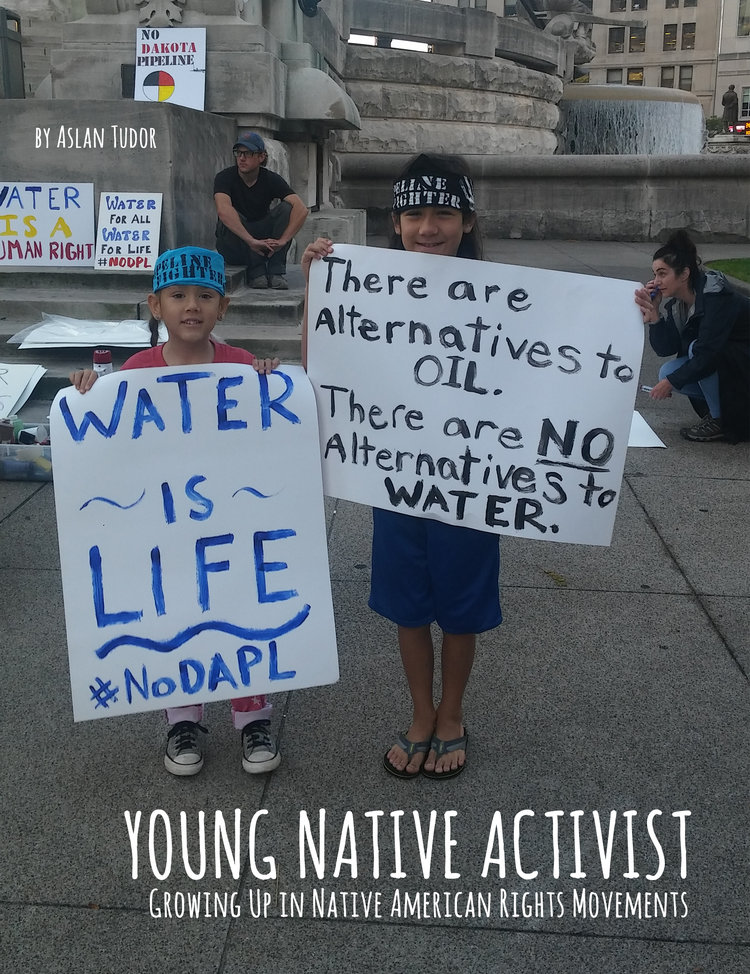 Cover of the book Young Native Activist by Aslan Tudor with a photograph of two young Native children holding signs that say "WATER IS LIFE #noDAPL" and "There are Alternatives to OIL. There are NO Alternatives to WATER."